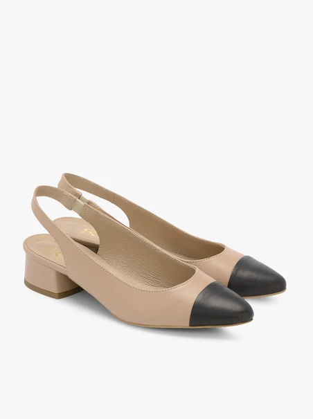 Beige pumps with black toe