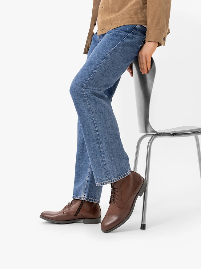 Brown lace-up boots with stitching