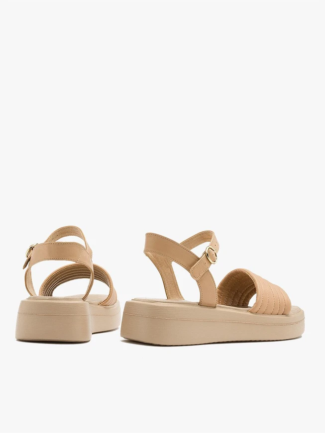 Beige sandals with gold buckle
