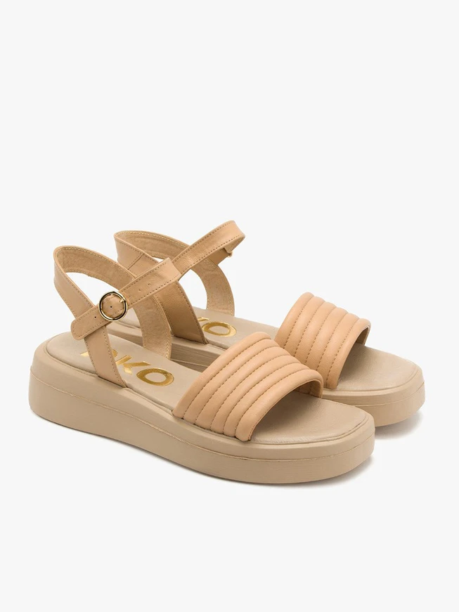 Beige sandals with gold buckle