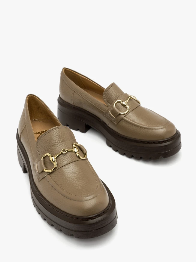 Beige loafers with gold ornament