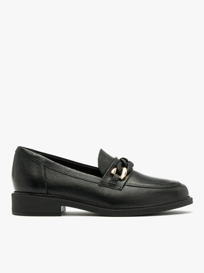 Black loafers with gold-and-black ornament