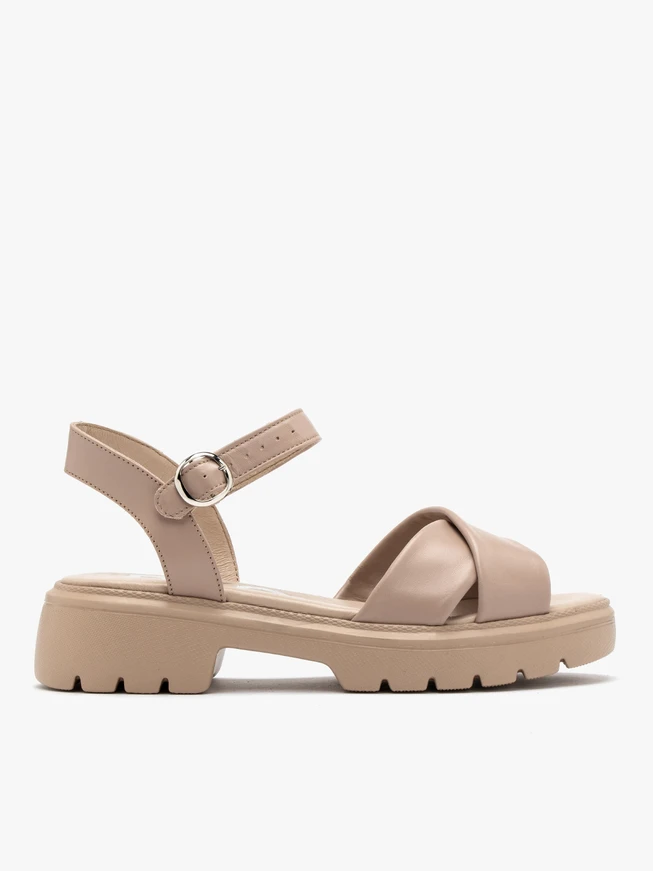 Beigefarbene Sandalen mit verziertem Schaft