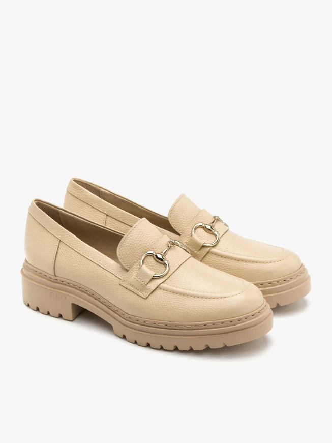 Beige loafers with gold ornament