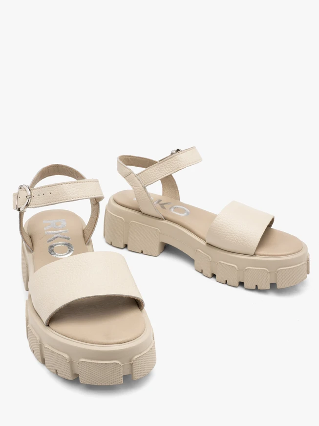 Cream sandals with silver buckle