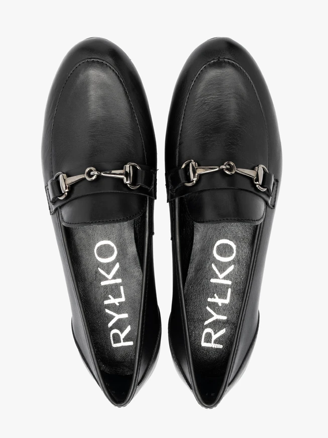 Black loafers with ornament on the upper