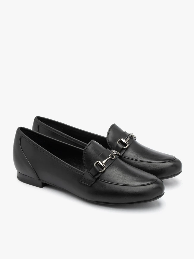 Black loafers with ornament on the upper