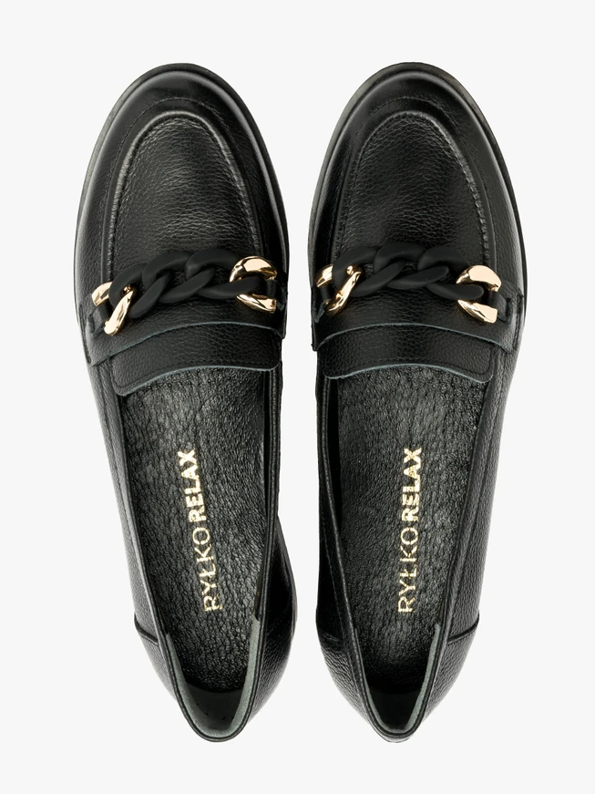 Black loafers with gold-and-black ornament