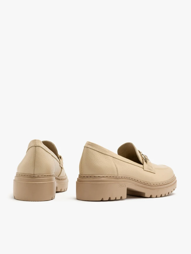 Beige loafers with gold ornament