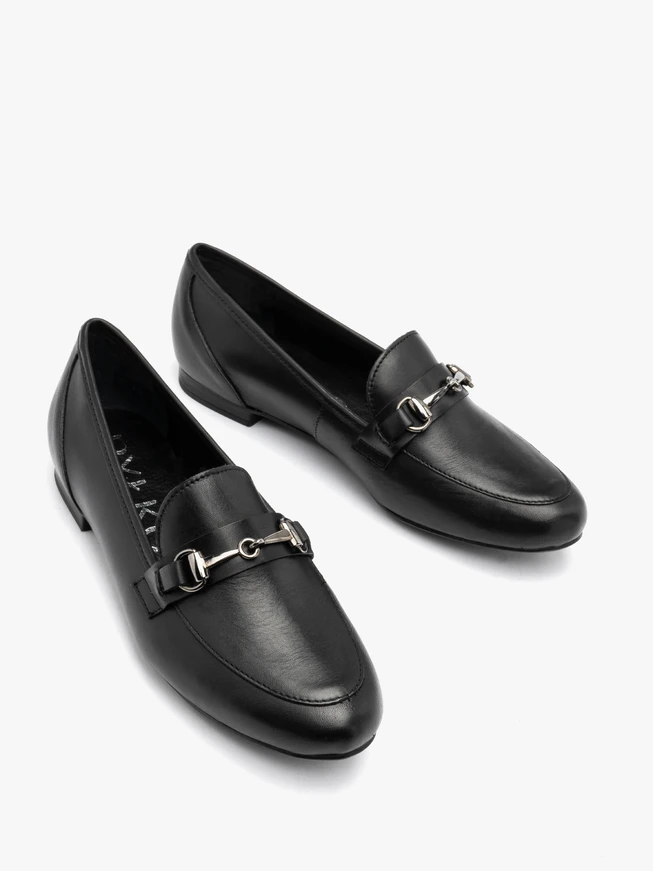Black loafers with ornament on the upper