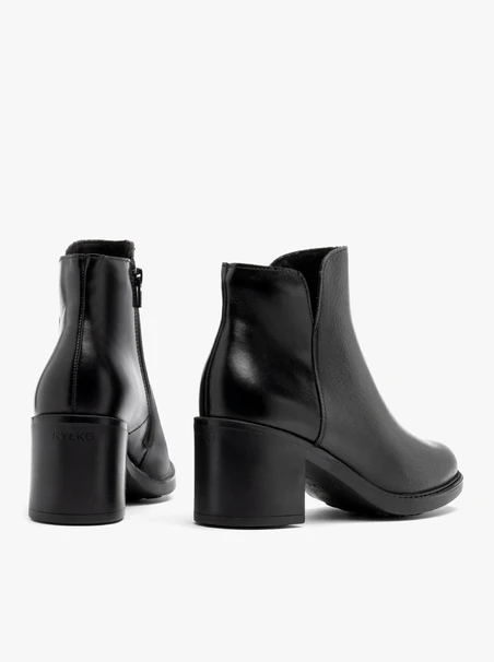 Black ankle boots with mixed-leather detailing