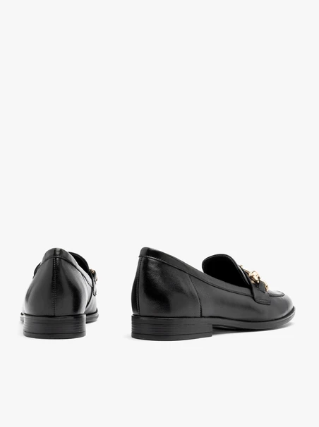 Black loafers with gold ornament