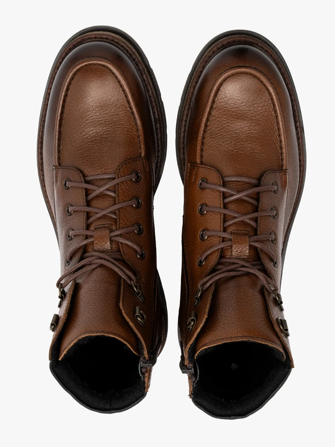 Brown men’s boots with decorative stitching on instep