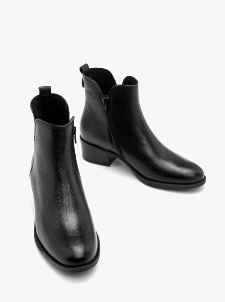 Black women’s ankle boots with decorative upper