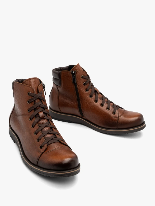 Brown men’s boots with beige-welted sole