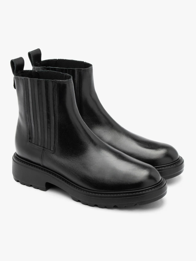 Black insulated Chelsea boots with stitched elastic