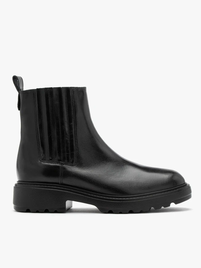 Black insulated Chelsea boots with stitched elastic
