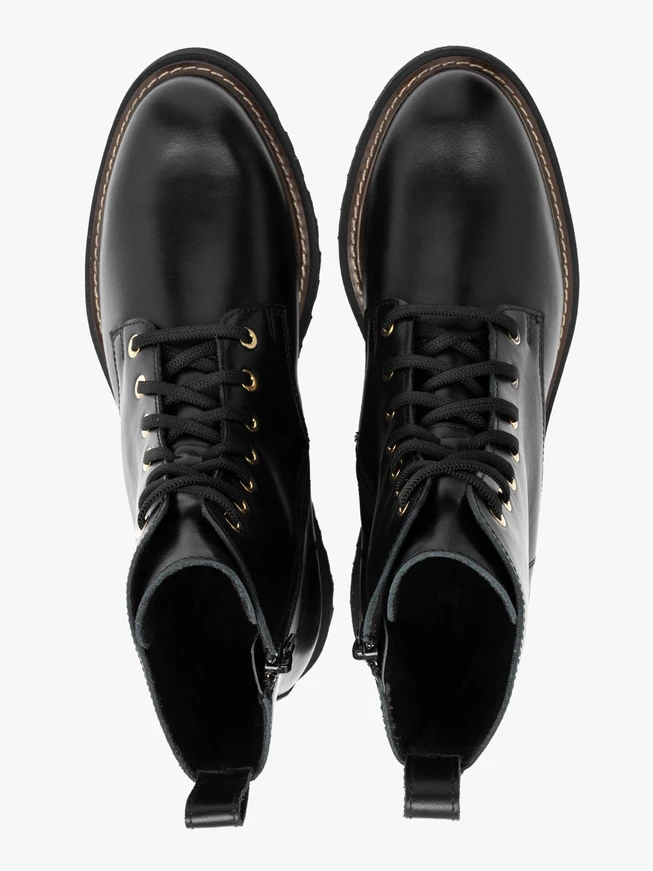 Black women’s boots with gold eyelets