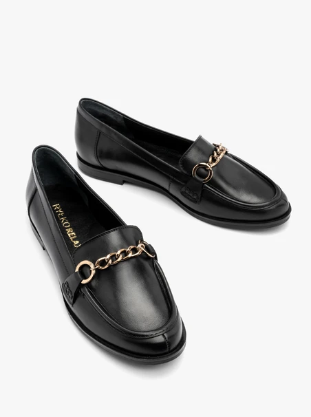 Black flat loafers with gold ornament