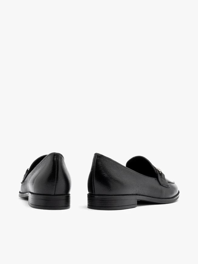 Black loafers with silver ornament