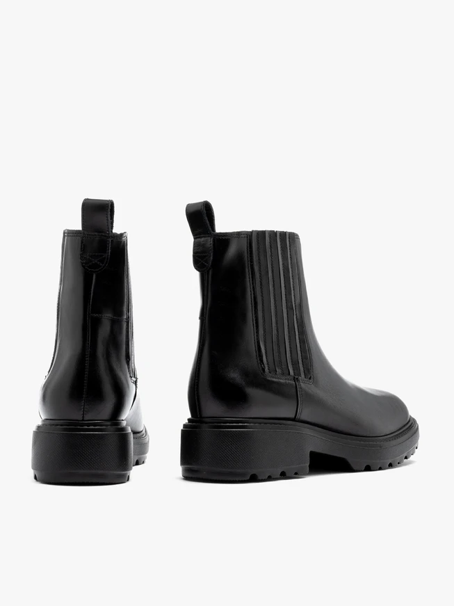 Black insulated Chelsea boots with stitched elastic