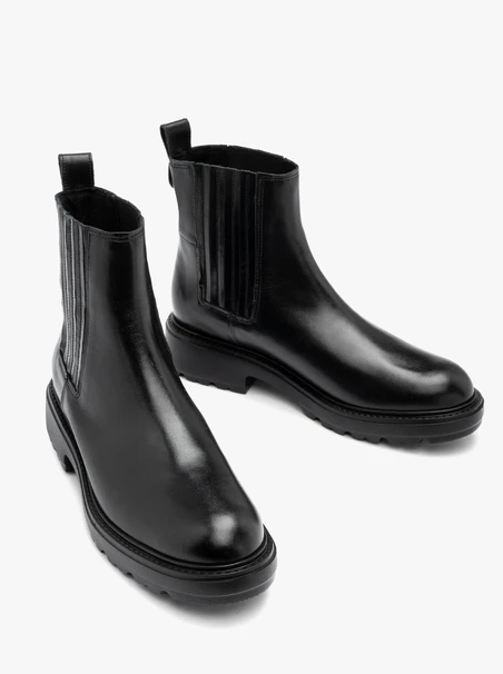 Schwarze isolierte Slingbacks mit Gumminähten