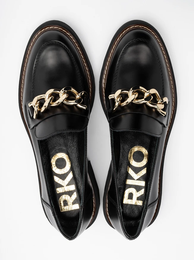 Black women’s loafers with chunky gold ornament