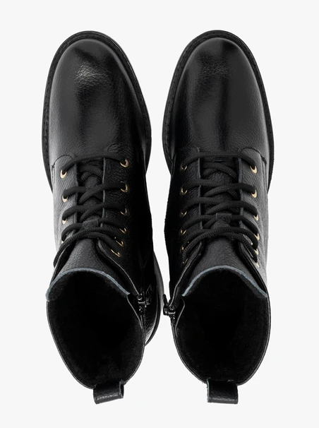 Black women’s lace-up boots with gold eyelets