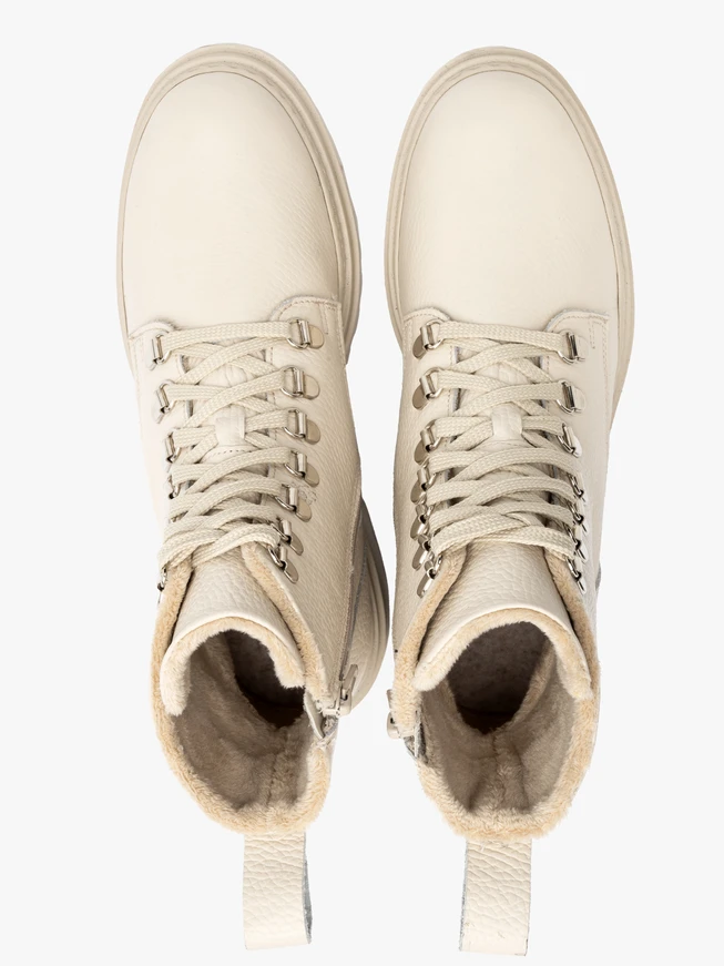 Cream women’s boots with decorative hooks