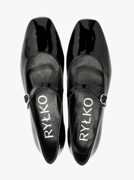 Black patent ballerinas with decorative strap