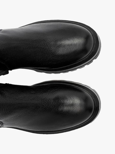 Black stretch ankle boots on a flat sole