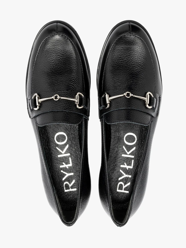 Black loafers with silver ornament