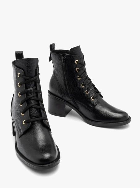 Black women’s lace-up boots with gold eyelets