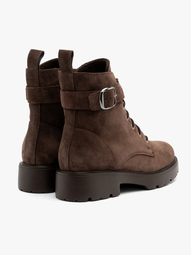 Brown women’s boots with decorative buckle