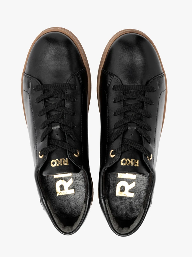 Schwarze sportliche Halbschuhe mit beigem Boden