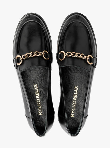 Black flat loafers with gold ornament