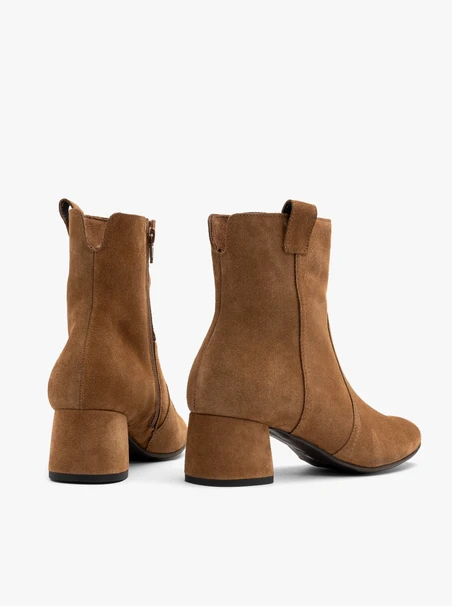 Rust suede ankle boots on a low heel