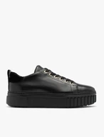 Black sporty shoes with gold details and thick sole