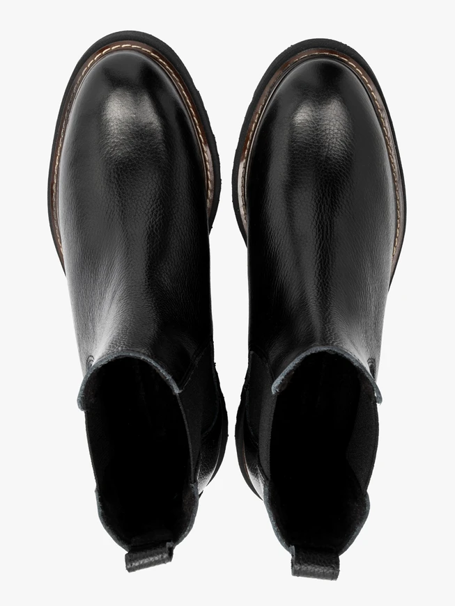 Black Chelsea boots with lug sole and contrast welt