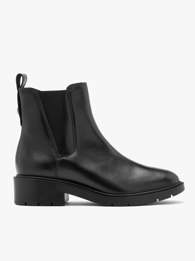 Black women’s Chelsea boots with decorative cut at the elastic