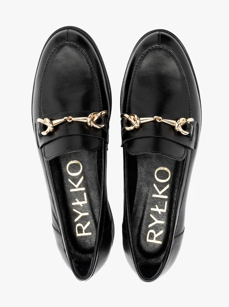 Black loafers with gold ornament