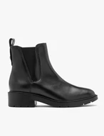Black women’s Chelsea boots with decorative cut at the elastic