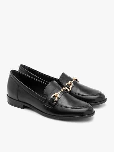 Black loafers with gold ornament