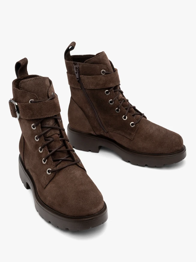 Brown women’s boots with decorative buckle