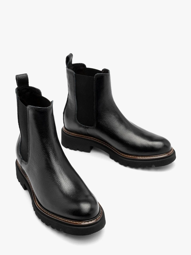 Black Chelsea boots with lug sole and contrast welt