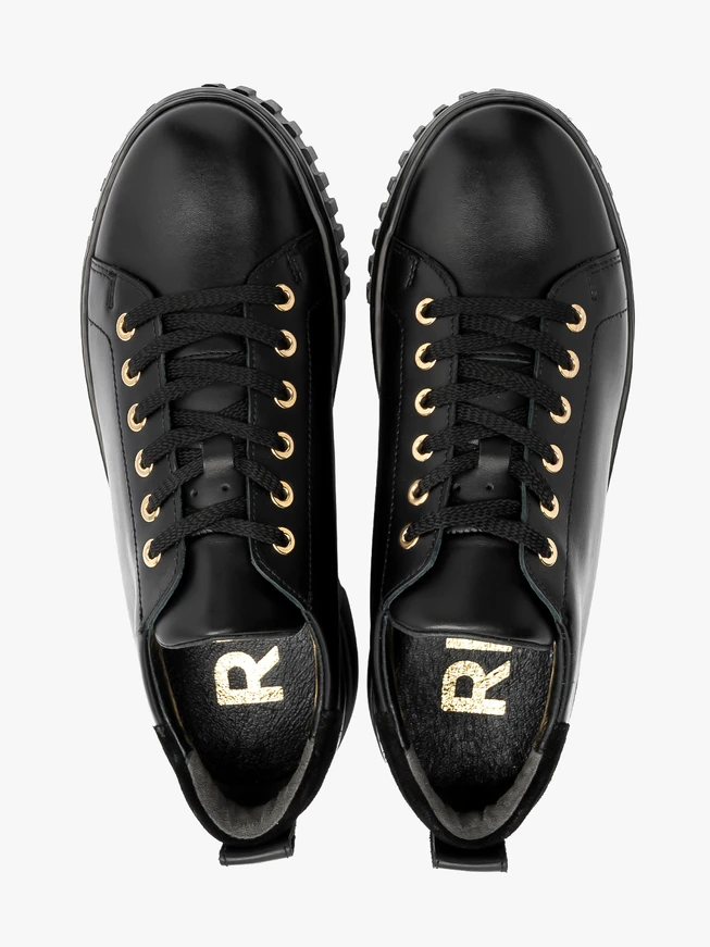Black sporty shoes with gold details and thick sole