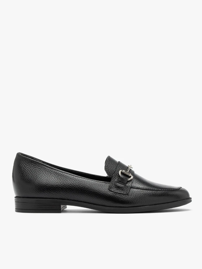 Black loafers with silver ornament