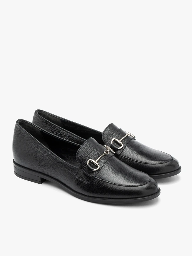 Black loafers with silver ornament