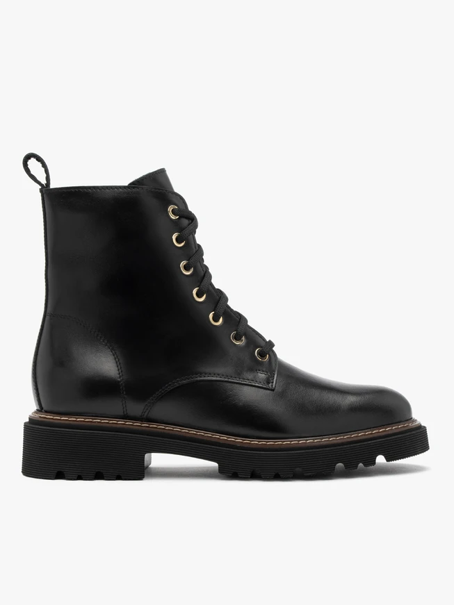 Black women’s boots with gold eyelets