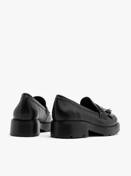 Black loafers with tassels